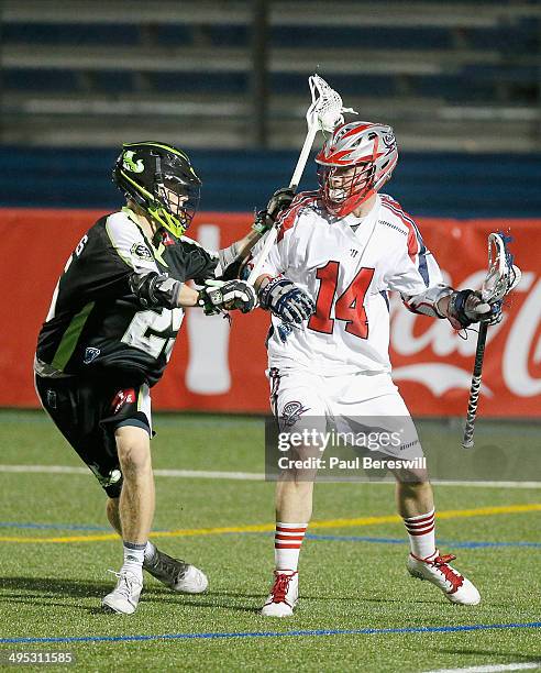 Ryan Boyle of the Boston Cannons is pressured by Brian Karalunas of the New York Lizards in a Major League Lacrosse game at James M. Shuart Stadium...