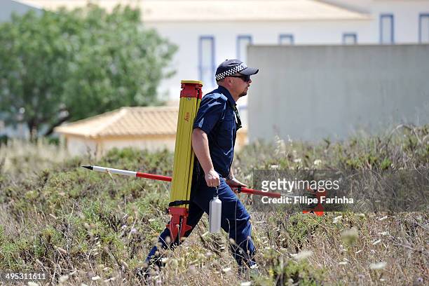 Police investigating the disappearance of Madeleine McCann search scrubland on June 2, 2014 in Praia da Luz, Portugal.