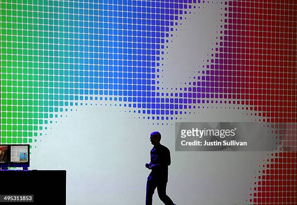 Apple CEO Tim Cook walks off stage after speaking during the Apple Worldwide Developers Conference at the Moscone West center on June 2, 2014 in San...
