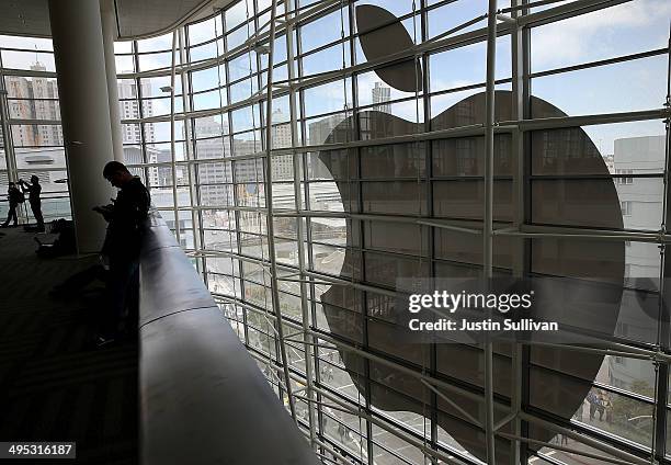 Attendees gather at the Apple Worldwide Developers Conference at the Moscone West center on June 2, 2014 in San Francisco, California. Apple CEO Tim...