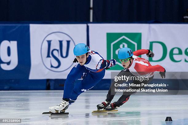 ZMONTREAL, QC Dmitry Migunov of Russia competes against Charle Cournoyer of Canada on Day 2 of the ISU World Cup Short Track Speed Skating...