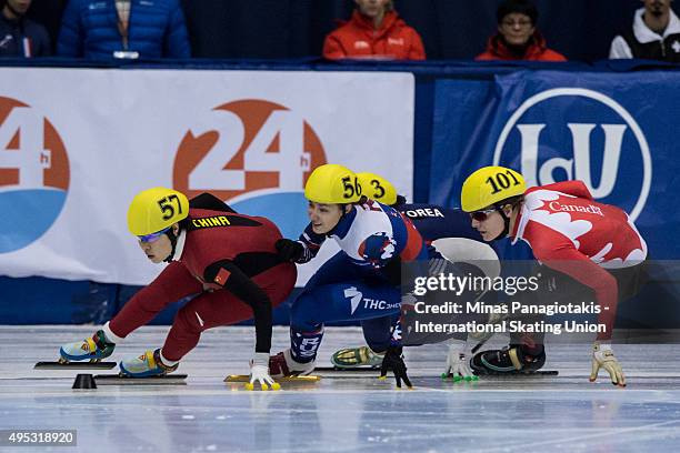 Zhou Yang of China Ekaterina Strelkova of Russia and Audrey Phaneuf of Canada battle for position on Day 2 of the ISU World Cup Short Track Speed...