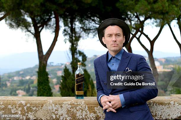 Jude Law toasts at the photocall of Johnnie Walker Blue Label's The Gentleman's Wager II at Villa Mondragone on October 31, 2015 in Rome, Italy.