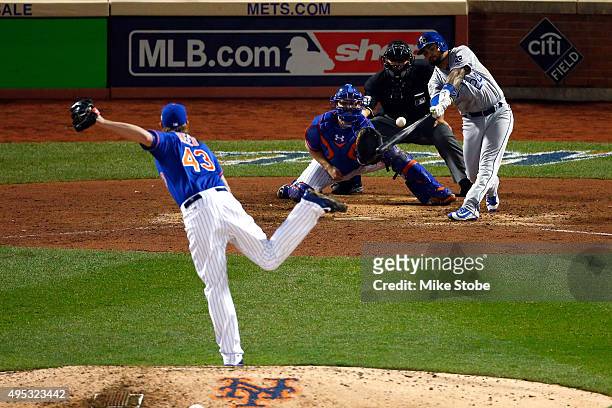 Christian Colon of the Kansas City Royals hits an RBI in the 12th inning against Addison Reed of the New York Mets during Game Five of the 2015 World...