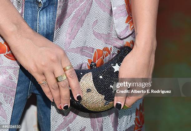 Actress Tia Mowry, purse detail attends the premiere of 20th Century Fox's "The Peanuts Movie" at The Regency Village Theatre on November 1, 2015 in...