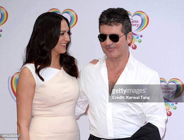 Lauren Silverman and Simon Cowell attend the Health Lottery tea party at the Savoy Hotel on June 2, 2014 in London, England.
