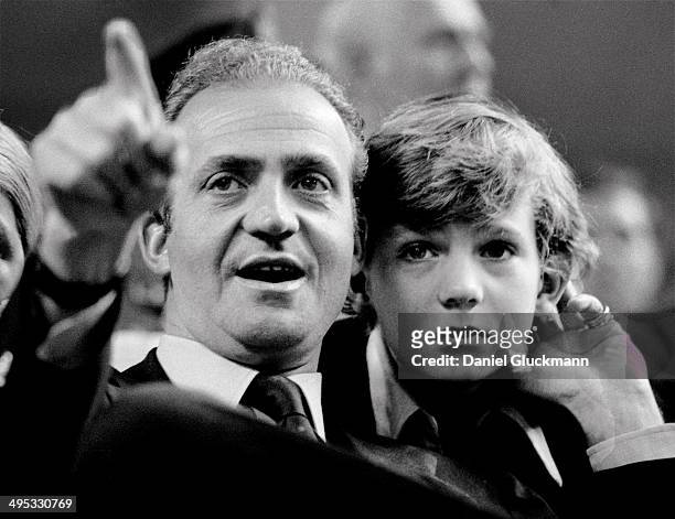 Juan Carlos, King of Spain, and his son the Prince Felipe watch a tennis match in Madrid, Spain in 1977. King Juan Carlos of Spain has renounced the...