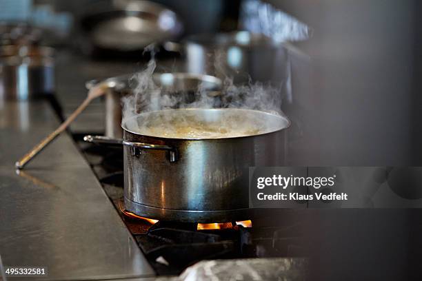 font cooking on stow in kitchen at restaurant - boiling pan ストックフォトと画像