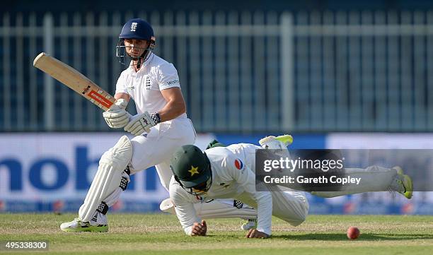 James Taylor of England hits past Azhar Ali of Pakistan during day two of the 3rd Test between Pakistan and England at Sharjah Cricket Stadium on...