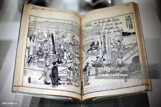 Pages from a woodblock-printed book by Takehara Shunchosai titled 'Hikida's Foreign Goods Shop' are pictured during a press preview for the Victoria...
