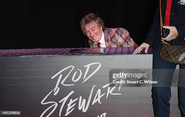 Rod Stewart poses for photographs prior to signing copies of his new album at HMV, Oxford Street on November 2, 2015 in London, England.