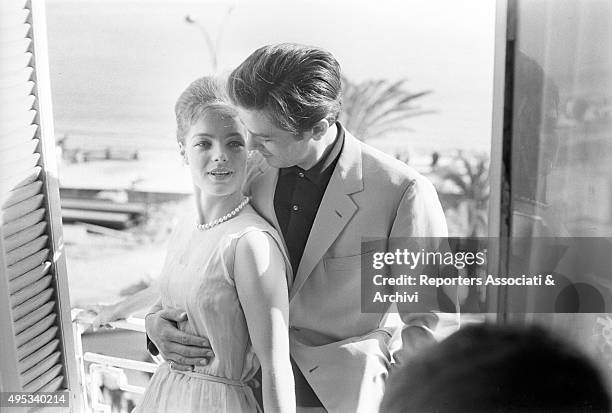 German-born French actress Romy Schneider and French actor, director and singer Alain Delon hugging each other. The couple is in Cannes for the 15th...