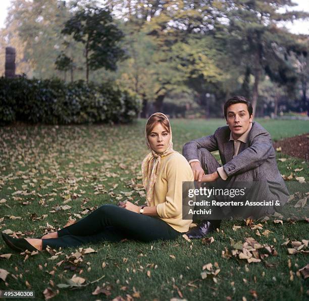 French actor Alain Delon and his wife Nathalie posing on the grass. 1960s