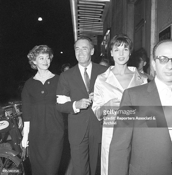 American actor Henry Fonda going toward the Sistina Theatre for Harry Belafonte's concert with his Italian wife and baroness Afdera Franchetti and...
