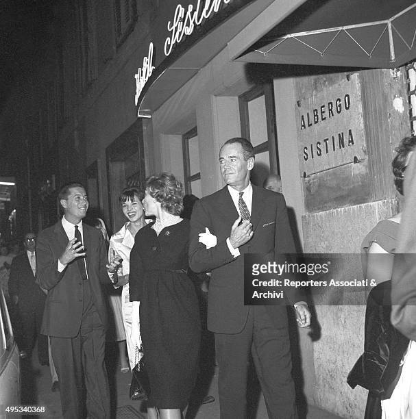 American actor Henry Fonda going toward the Sistina Theatre for Harry Belafonte's concert with his Italian wife and baroness Afdera Franchetti....