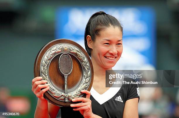 Kimiko Date-Krumm celebrates with the trophy after winning the Women's Singles final against Yurika Sema at Ariake Coliseum on November 15, 2008 in...