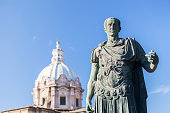Statue Roman Emperor in front of church in Rome