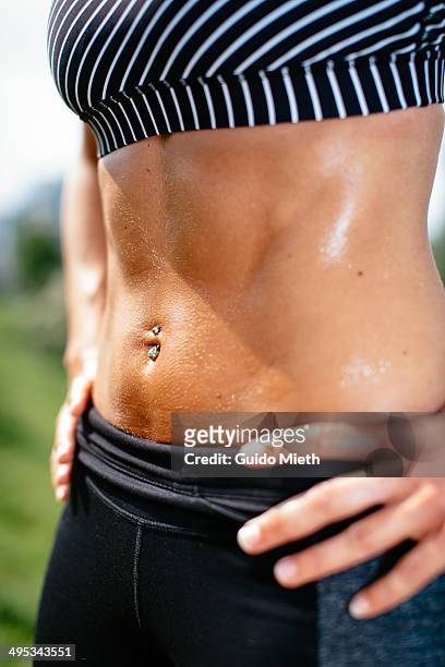 flat trained belly of woman. - flat stomach stockfoto's en -beelden