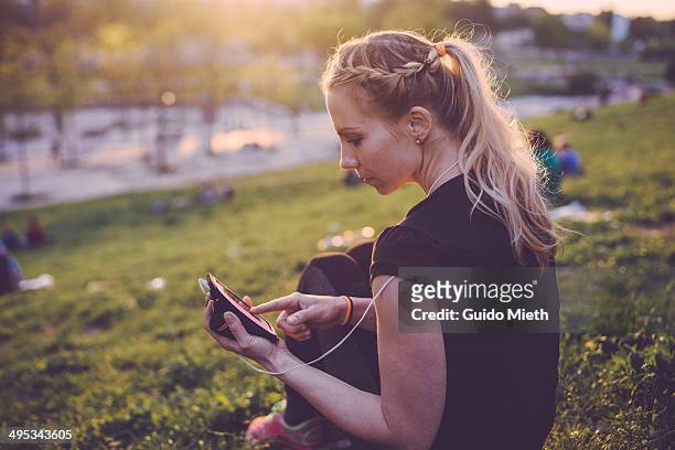woman having a rest in park. - woman 30 outside stock-fotos und bilder