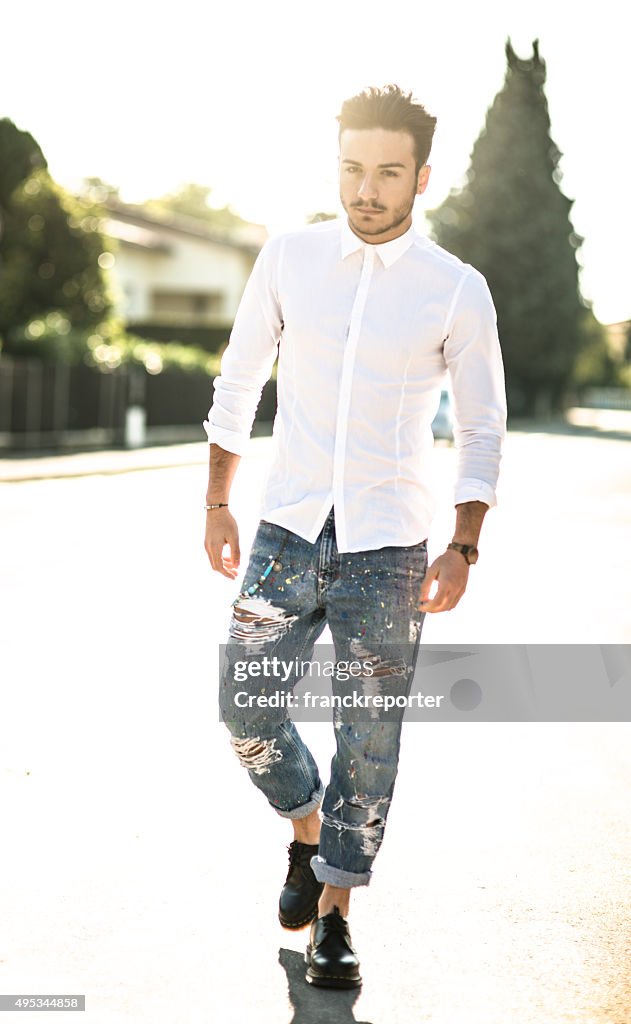 Fashionable man on the street at dusk