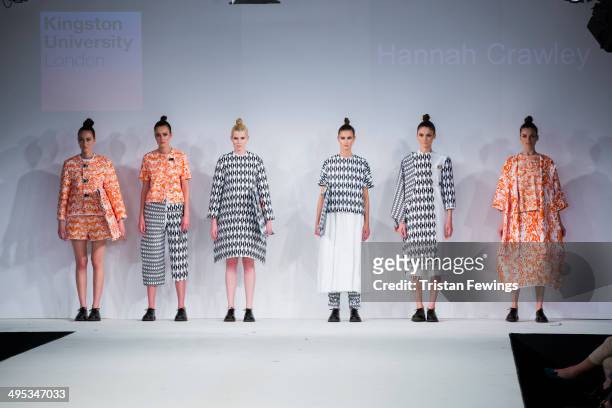 Models walk the runway wearing designs by Hannah Crawley during the Kingston University show during day 3 of Graduate Fashion Week 2014 at The Old...