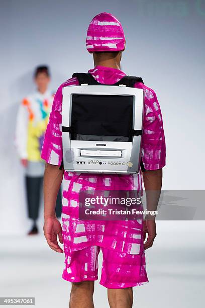 Model walks the runway wearing designs by Trina Outram during the Kingston University show during day 3 of Graduate Fashion Week 2014 at The Old...