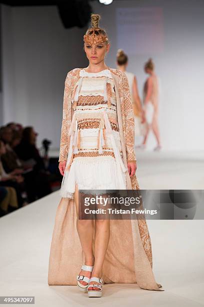 Model walks the runway wearing designs by Jessica Sharp during the Kingston University show during day 3 of Graduate Fashion Week 2014 at The Old...