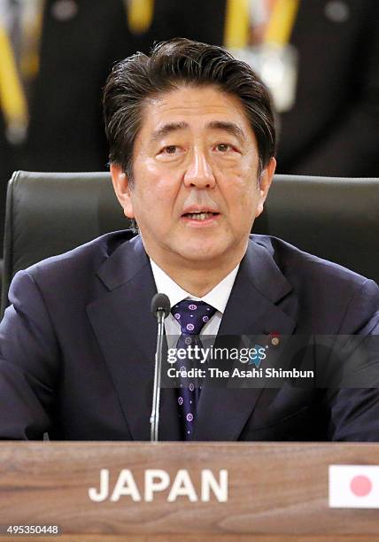 Japanese Prime Minister Shinzo Abe addresses during the trilateral summit between Japan, South Korea and China at the presidential Blue House on...