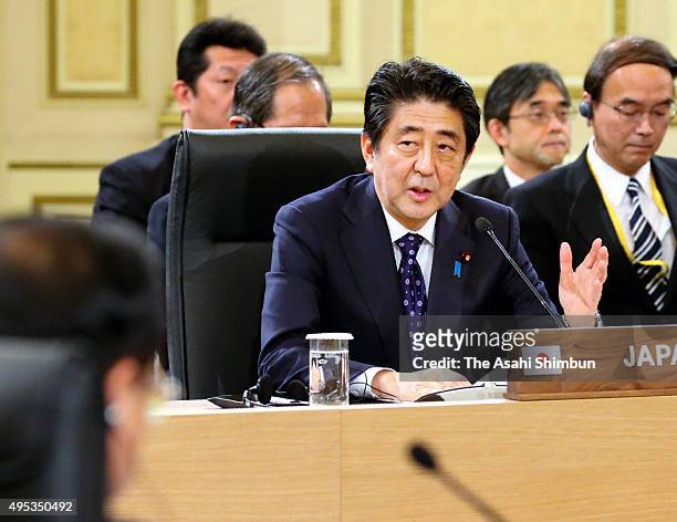 Japanese Prime Minister Shinzo Abe addresses during the trilateral summit between Japan, South Korea and China at the presidential Blue House on...