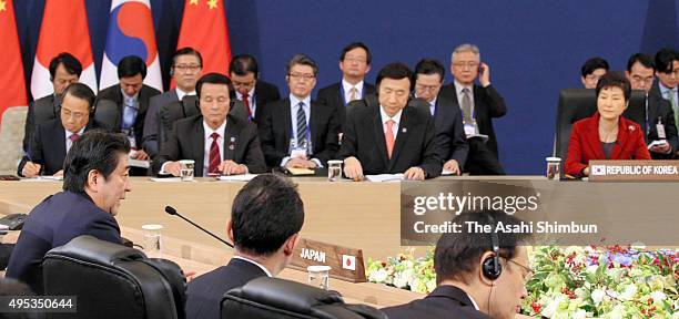 Japanese Prime Minister Shinzo Abe addresses during the trilateral summit between Japan, South Korea and China at the presidential Blue House on...