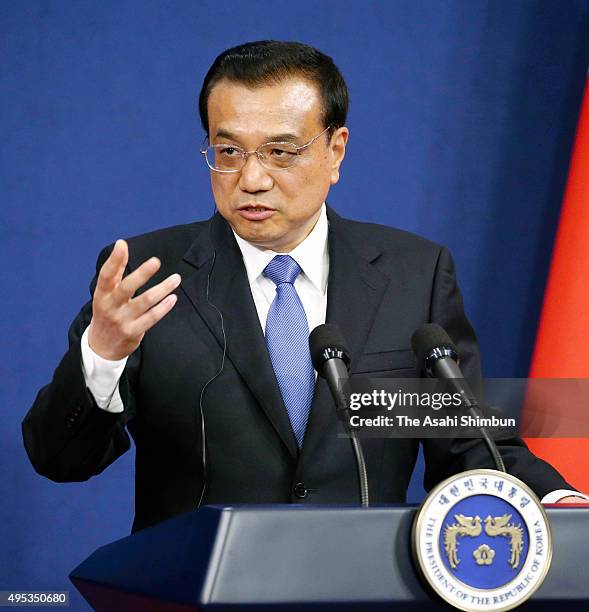 Chinese Premier Li Keqiang addresses during a joint press conference after the trilateral summit between Japan, South Korea and China at the...