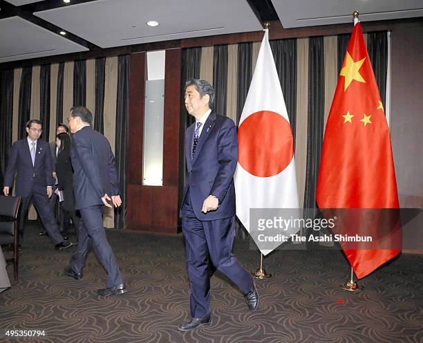 Japanese Prime Minister Shinzo Abe and Chinese Premier Li Keqiang attend their meeting on the sidelines of the trilateral summit between Japan, South...