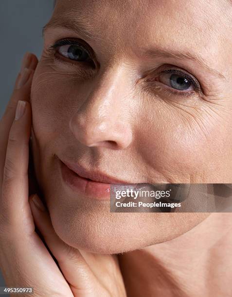 age has no effect on her beauty! - 40 year old woman blonde blue eyes stock pictures, royalty-free photos & images