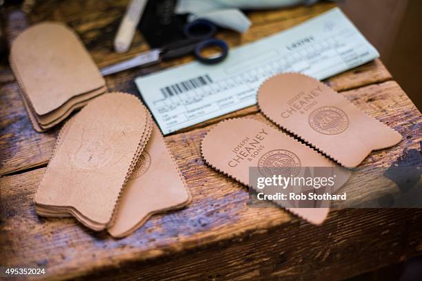 Branded shoe parts are seen at the Joseph Cheaney and Sons factory on August 25, 2015 in Desborough, United Kingdom. J. Cheaney, Boot & Shoemakers...