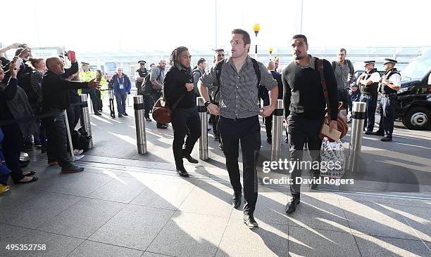 Richie McCaw, captain of Rugby World Cup winners, the New Zealand All Blacks arrives with team mates at Heathrow Airport at the start of their...