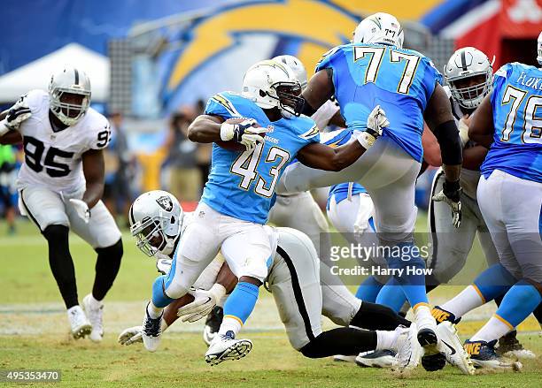 Branden Oliver of the San Diego Chargers rushes against the Oakland Raiders at Qualcomm Stadium on October 25, 2015 in San Diego, California.
