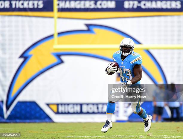 Branden Oliver of the San Diego Chargers cuts back during a carry against the Oakland Raiders at Qualcomm Stadium on October 25, 2015 in San Diego,...