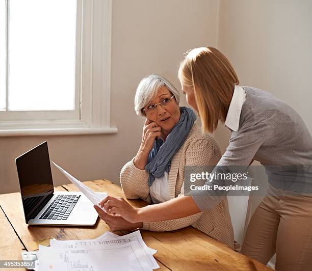 giving her grandmother some much needed assistance - grandma invoice bildbanksfoton och bilder