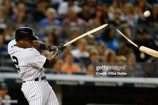 Alfonso Soriano of the New York Yankees breaks his bat fouling the ball off in the sixth inning against the Seattle Mariners at Yankee Stadium on...