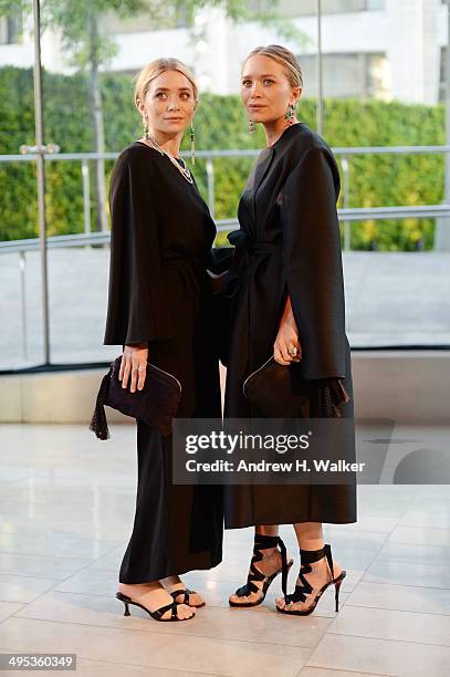 Designers Ashley Olsen and Mary-Kate Olsen attend the 2014 CFDA fashion awards at Alice Tully Hall, Lincoln Center on June 2, 2014 in New York City.