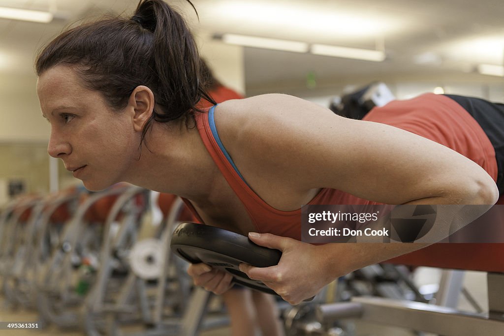 Female . athlete working out in a gym.
