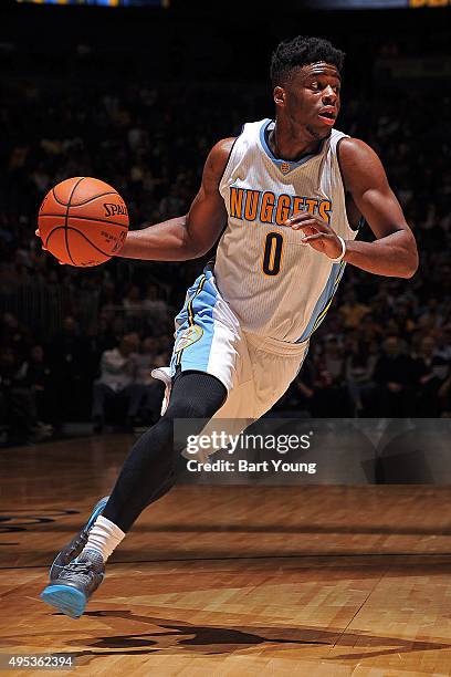 Emmanuel Mudiay of the Denver Nuggets drives to the basket against the Minnesota Timberwolves on October 30, 2015 at the Pepsi Center in Denver,...