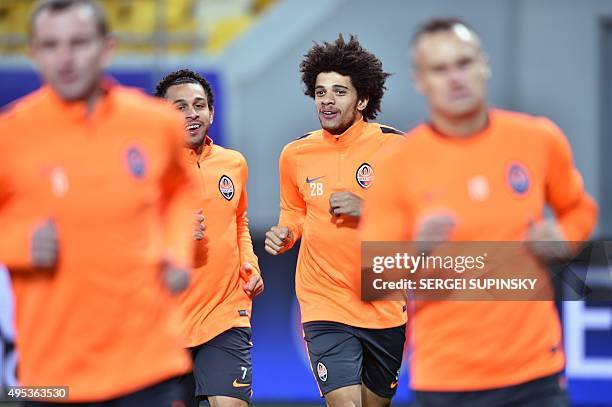 Shakhtar Donetsk's Brazilian players Taison and Wellington Nem take part in a training session at Arena Lviv Stadium in Lviv on November 2, 2015 day...