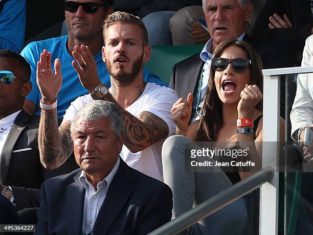 Matt Pokora aka M Pokora and his girlfriend attend Gael Monfils' match on Day 9 of the French Open 2014 held at Roland-Garros stadium on June 2, 2014...
