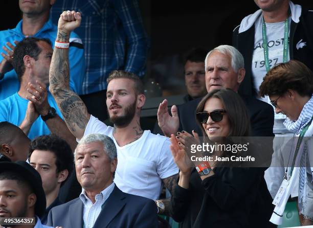 Matt Pokora aka M Pokora and his girlfriend attend Gael Monfils' match on Day 9 of the French Open 2014 held at Roland-Garros stadium on June 2, 2014...