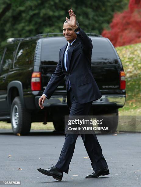 President Barack Obama walks from the Oval Office of the White House to board Marine One in Washington as he departs for Newark, New Jersey on...