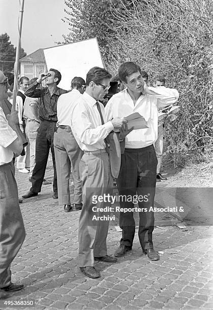 Italian director Pier Paolo Pasolini reading the script with Italian actor Franco Citti on the set of the film Accattone. Rome, 1961