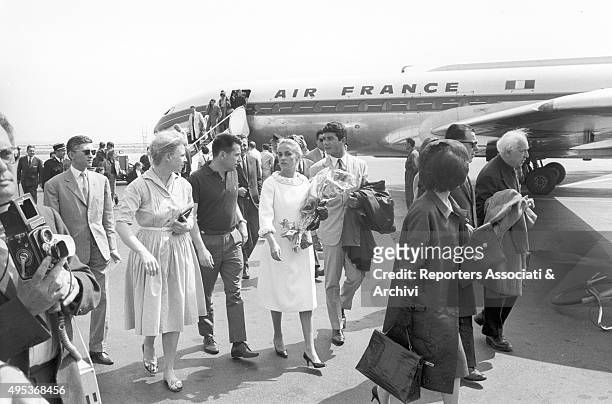 French singer, actress and director Jeanne Moreau and French actor and director Jean-Claude Brialy arriving at Cannes airport for the 15th Cannes...