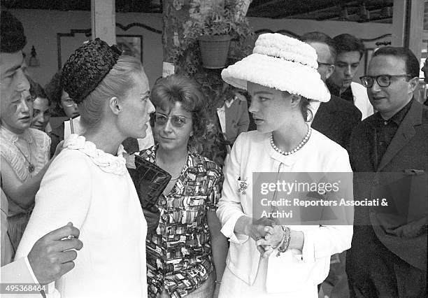 French singer, actress and director Jeanne Moreau talking to German-born French actress Romy Schneider at a lunch held for the 15th Cannes film...
