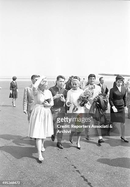 French singer, actress and director Jeanne Moreau and French actor and director Jean-Claude Brialy arriving at Cannes airport for the 15th Cannes...